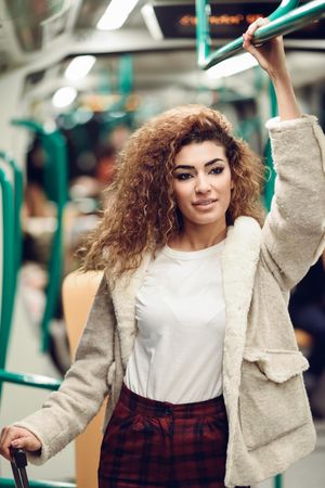 Arab woman in subway carriage