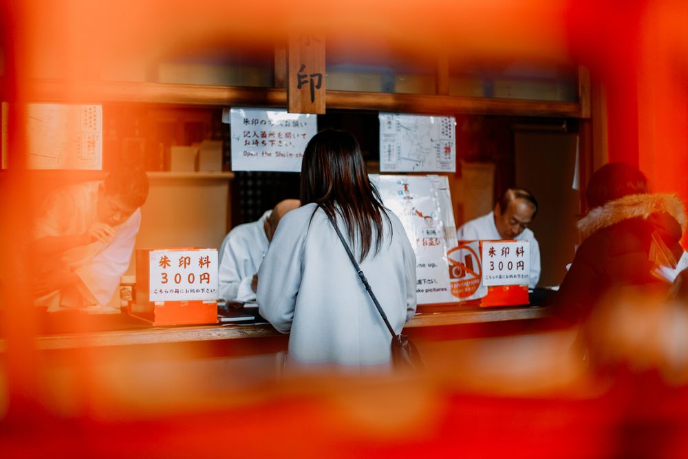 Back view of woman standing near cashier