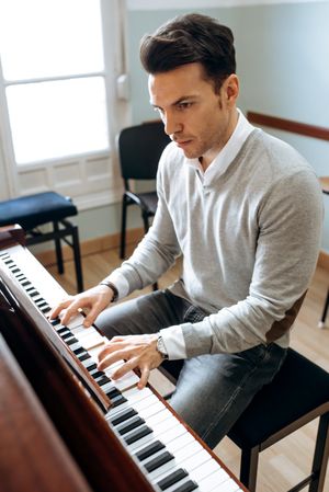 Man playing piano in studio