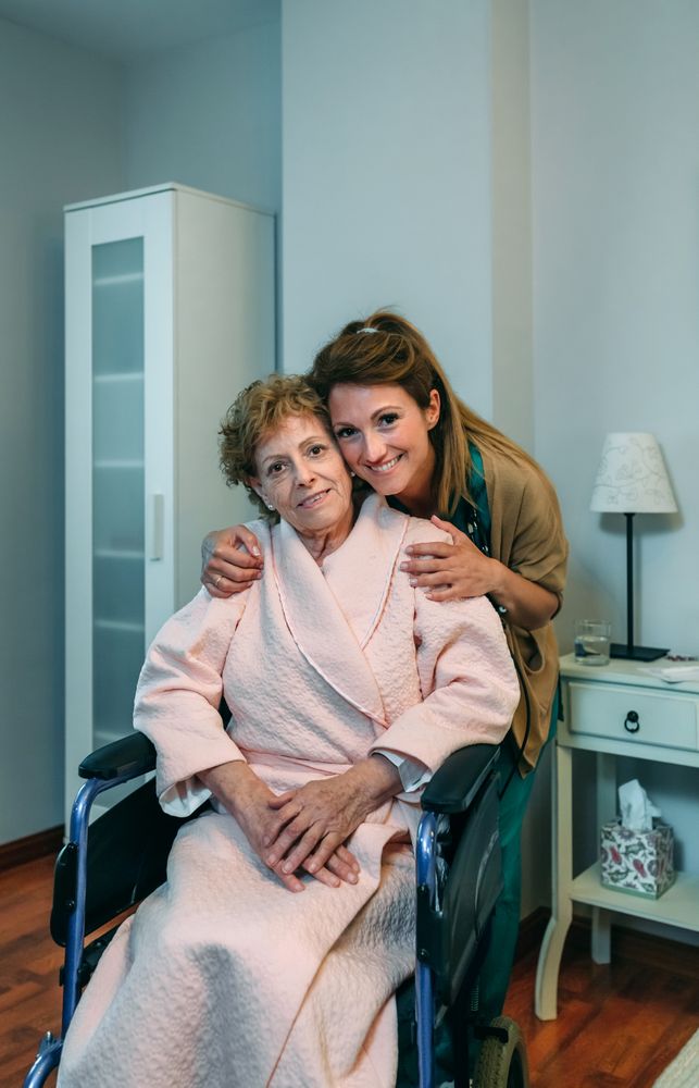 Affectionate caretaker posing with mature patient