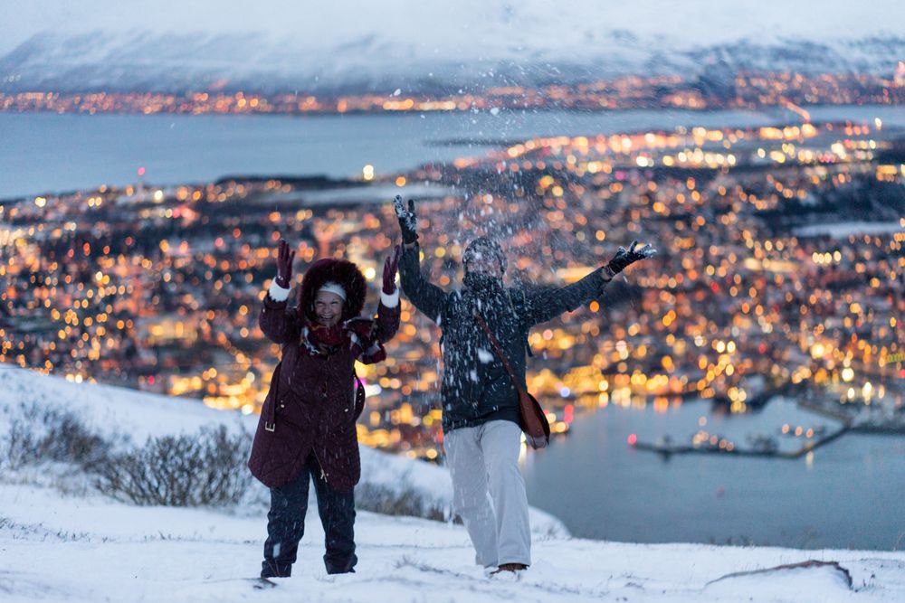 Cheerful couple having fun in snowy weather