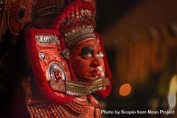 Side view of man wearing Theyyam costume as form of dance worship 48Eajb