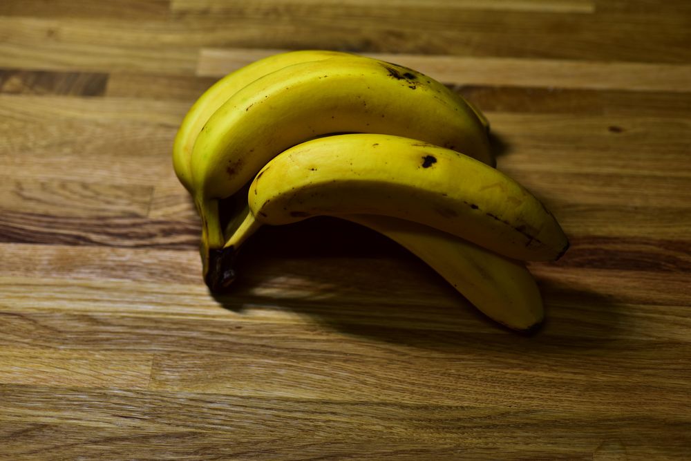 Yellow banana on a wooden table.
