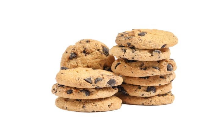 Tasty chocolate chip cookies on studio background