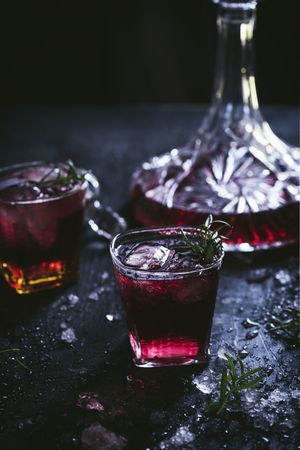 Glasses and carafe with red wine on table