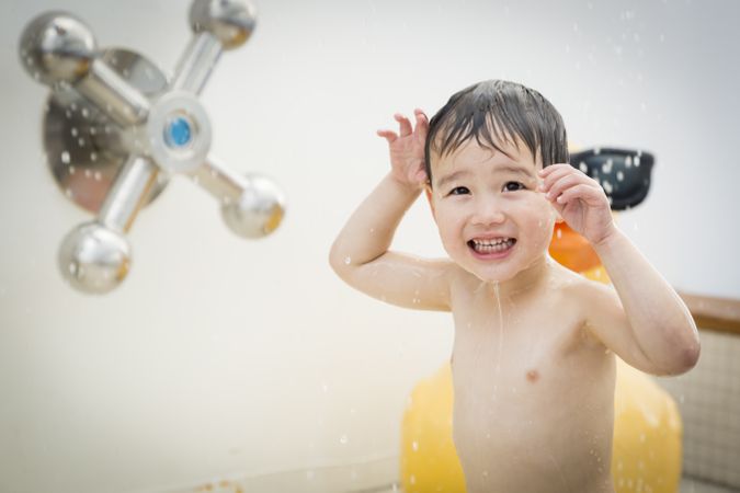 Happy boy playing at the water park