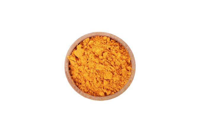 Top view of bowl of loose turmeric powder