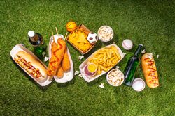 Traditional sport stadium foods and beer background