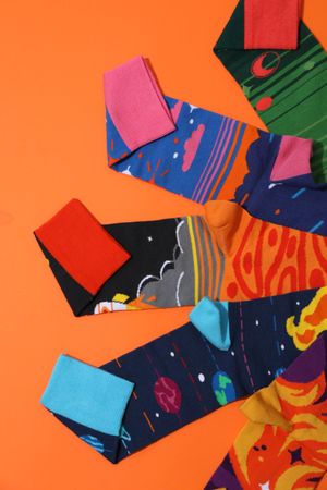 Casual clothes and wearing concept - socks, clothes for foot