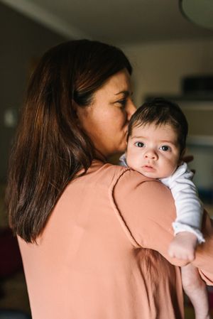 Mother holding baby in arms