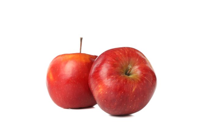Two apples on plain background