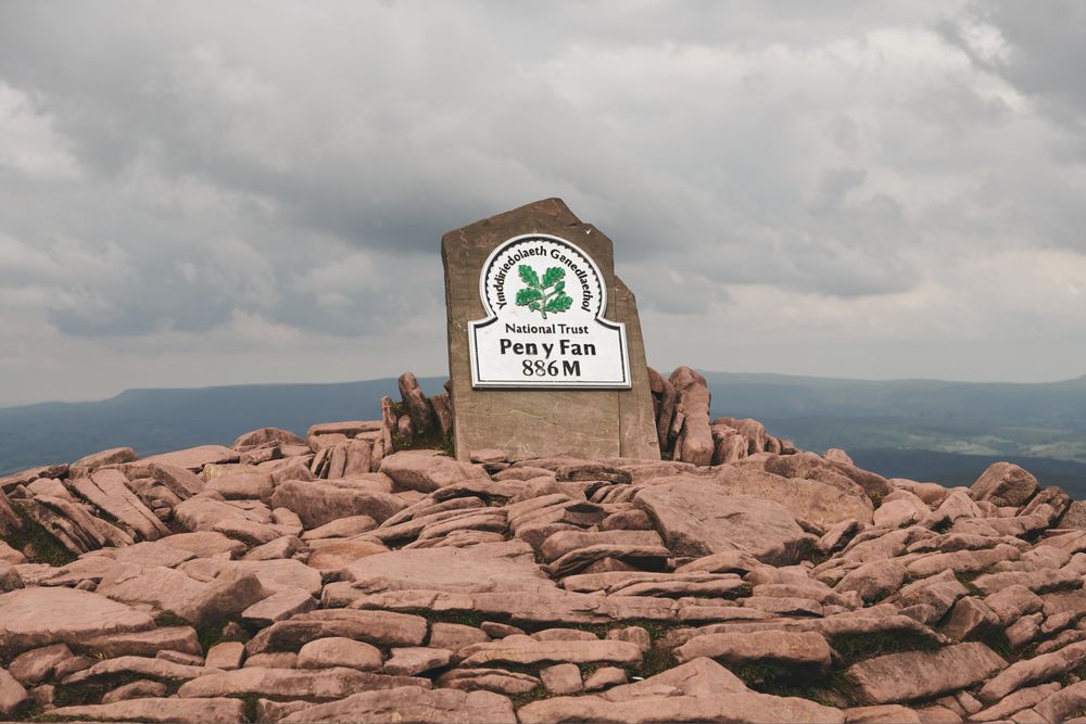 Plaque at the peak of the mountains on an overcast day