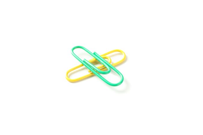 Color paper clips isolated on plain background