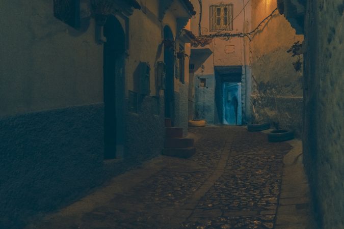 Old narrow street of town at night