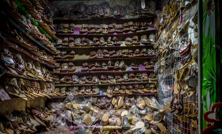 Looking into a shoe stall at the market