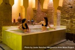 Friends enjoying luxurious baths in spa 4MeEy4