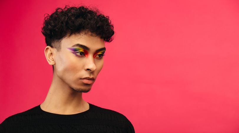 Male with pride flag eye shadow