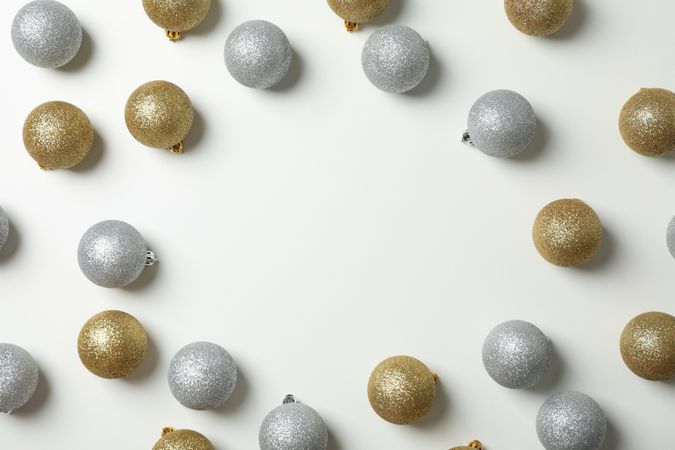Composition with christmas balls on plain background, space for text