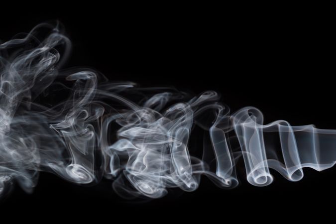 Abstract smoke moving on dark background