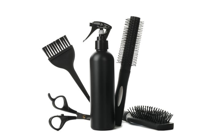 Different hairdresser accessories isolated on plain background