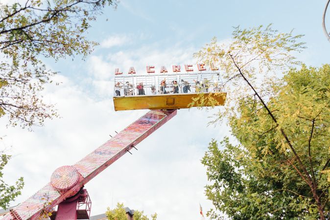 Amusement ride amidst trees in park