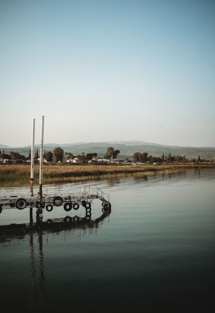 Weathered pier near calm water