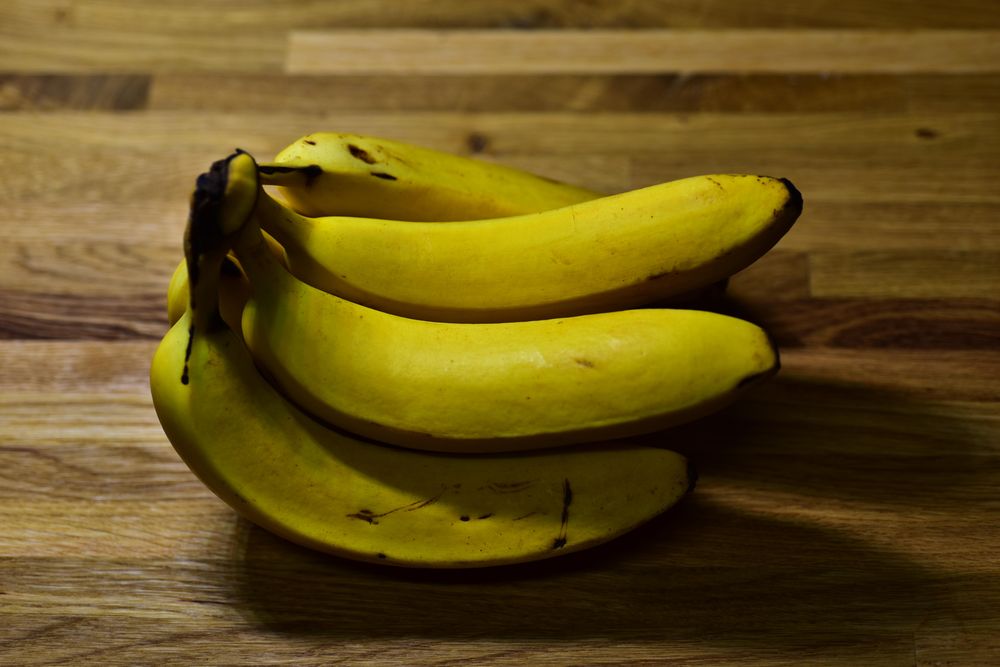 Yellow banana on a wooden table.