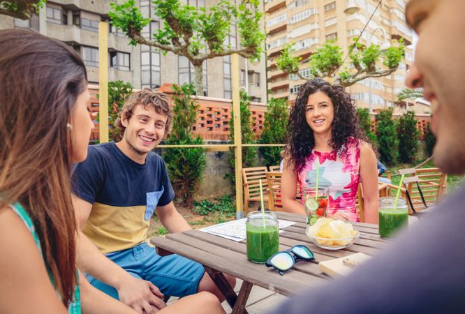 Snacks and drinks enjoyed by friends outside