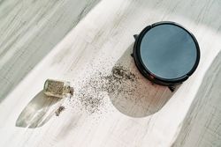 Vacuum cleaner and glitters on floor
