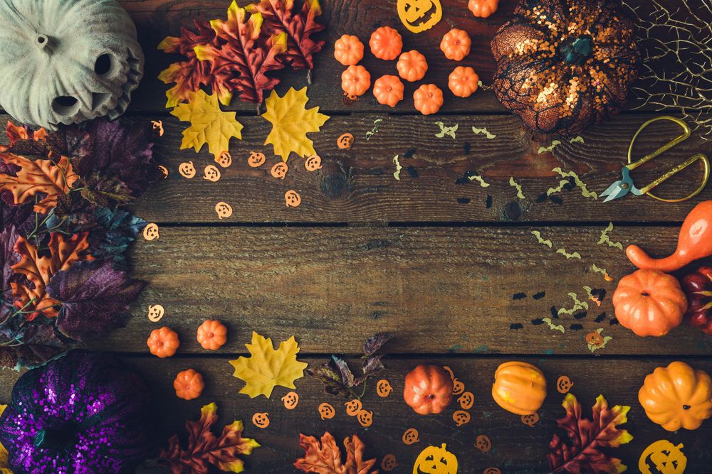 Border of autumn and Halloween items with various leaves and pumpkins