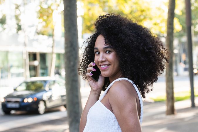 Smiling Black woman on a phone call on smartphone
