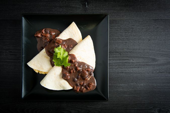 Veracruz eggs wrapped in tortillas decorated with sauce