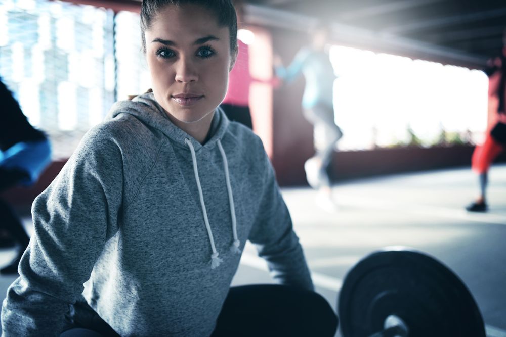 Close up of woman with barbell
