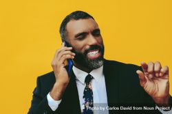 Serious Black businessman having a call on a smartphone screen bE177b