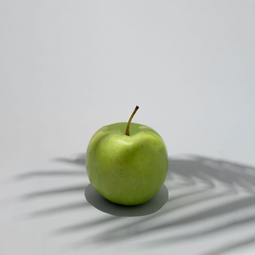 Apple under the sunny summer shade