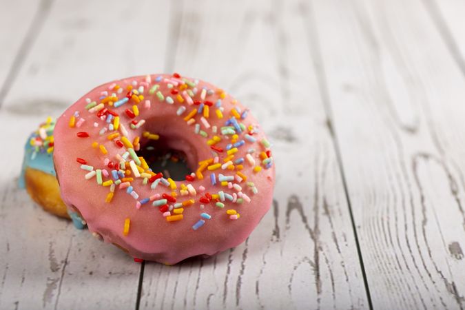 Delicious assorted colorful donuts on the table.