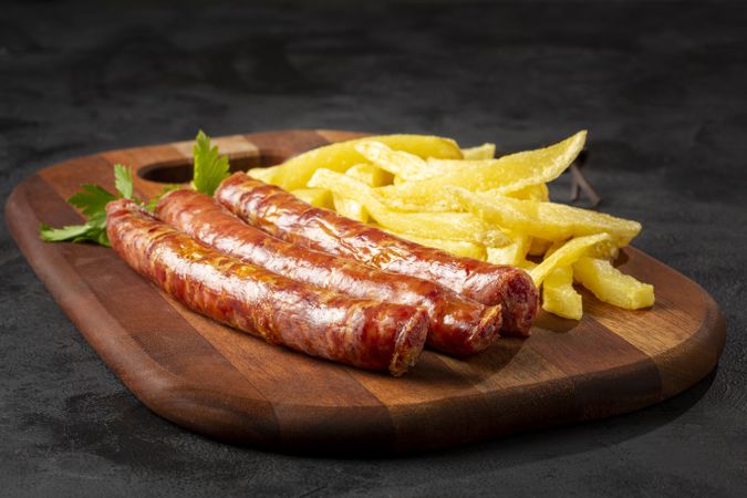 Grilled German sausage with french fries.