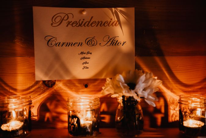Wall with wedding decorations on shelves