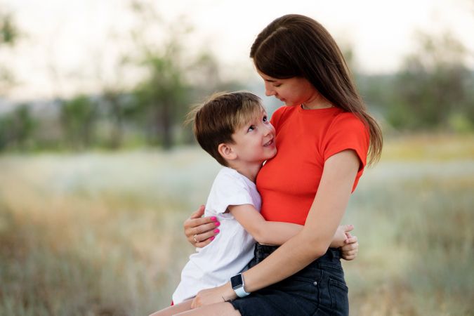 Affectionate mom with son outdoor
