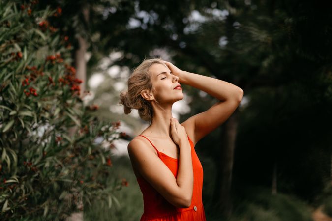 Dreamy young woman in summer garden