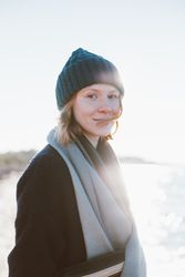 Red haired woman in hat and scarf on a cold day
