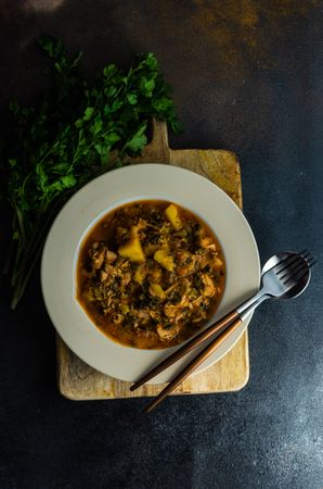 Famous Georgian meat and vegetable dish Souzi served with cilantro, with copy space
