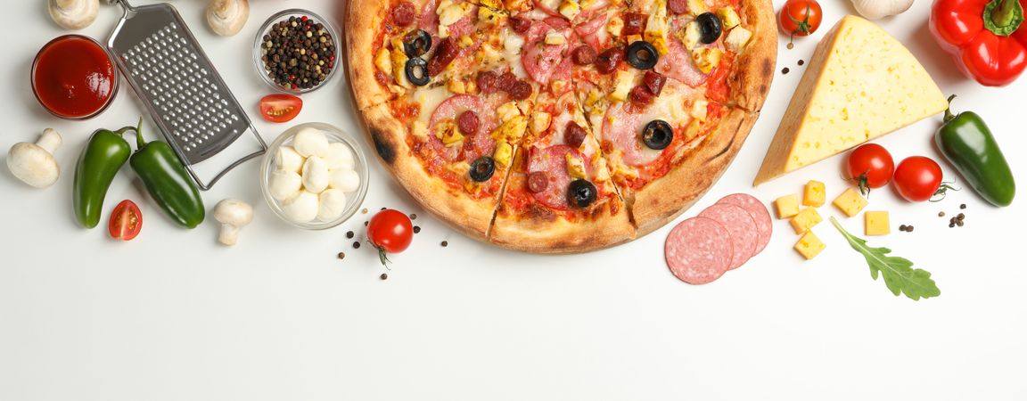 Tasty pizza and ingredients on neutral background, space for text
