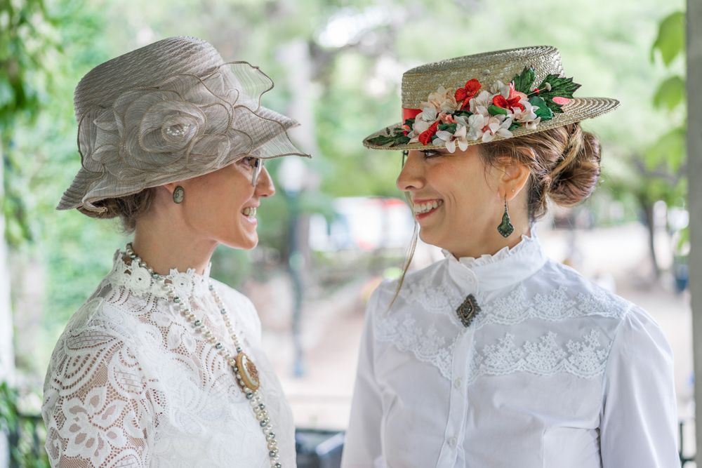Vintage female friends speaking in garden