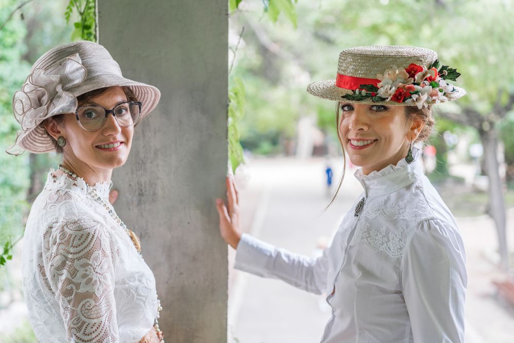 Vintage female friends speaking in garden