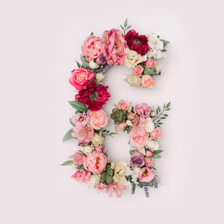 Letter G made of real natural flowers and leaves