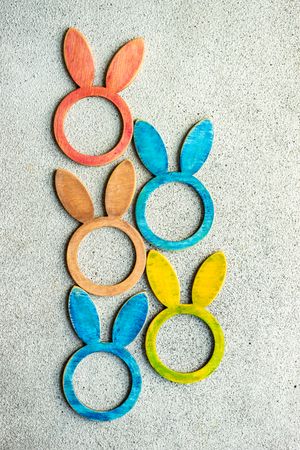 Easter card concept with colorful rabbit napkin rings