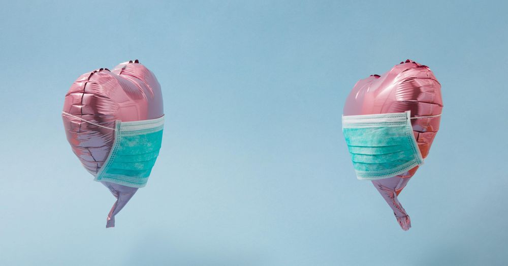 Pink foil heart balloons with protective mask