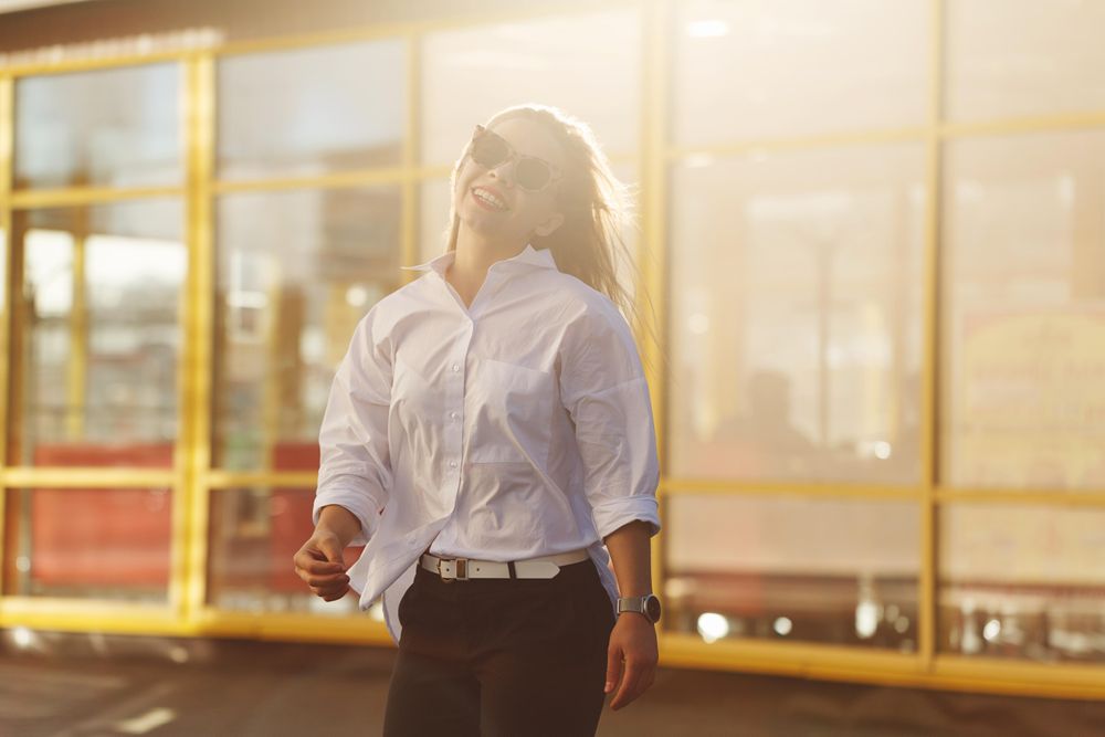 Woman stands on the street of the city, vertical