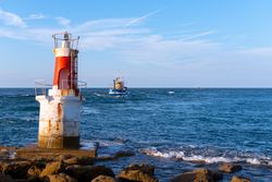 Lighthouse on rocky coastline
